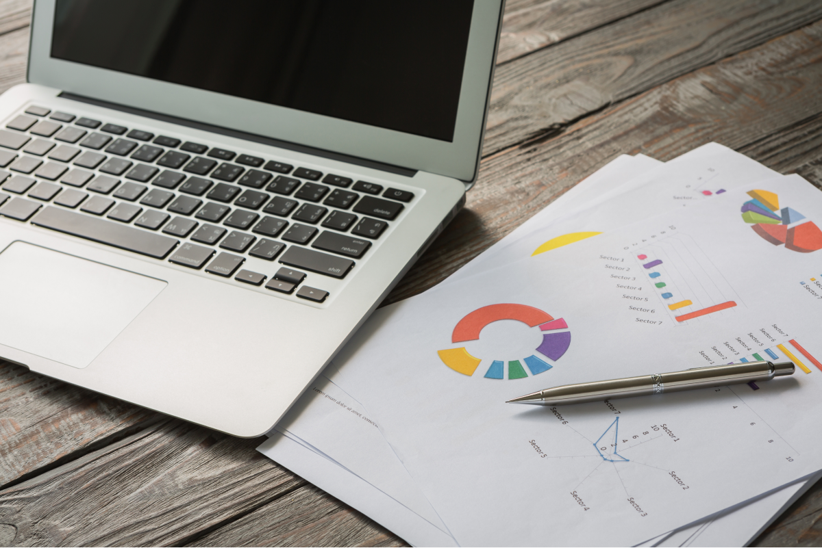 laptop with colorful business documents